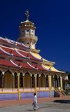 The Holy See of the Cao Dai is in the Vietnamese province of Tay Ninh, close to the Cambodian frontier, and this syncretic religion – which counts Victor Hugo, Laozi and Jesus among its saints – has also made some Khmer converts.<br/><br/>

Vietnam has two indigenous religious sects, both of which were established in the 20th century, and both of which are based firmly in the south of the country. Cao Dai or ‘Supreme Altar’ is a syncretic faith combining aspects of the tam giao with Catholicism and is the larger of the two, with an estimated 2 million followers. Cao Dai is an eclectic amalgam of Confucianism, Taoism, Buddhism and Catholicism. The second sect, called Hoa Hao or ‘Peace and Happiness’, is centred on Chau Doc in the Mekong Delta. Its followers practise an ascetic and austere form of Buddhism.<br/><br/>

The Cao Dai religion was founded in 1919 by a Vietnamese civil servant, Ngo Van Chieu and by the mid-1920s Tay Ninh had developed as the ‘Holy See’ of the new religion, with a hierarchy organised under a Cao Dai pope. Initially persecuted by the communists, Cao Dai is now tolerated, and has an estimated two million followers, mainly in the south.